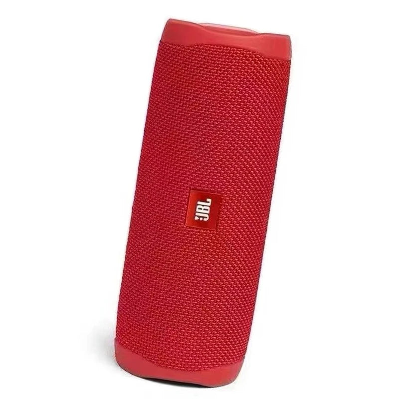 Enceinte Bluetooth portable JBL Flip 5, étanche IPX7, avec mini caisson de basses et basses profondes, idéale pour le camping et le sport en extérieur.